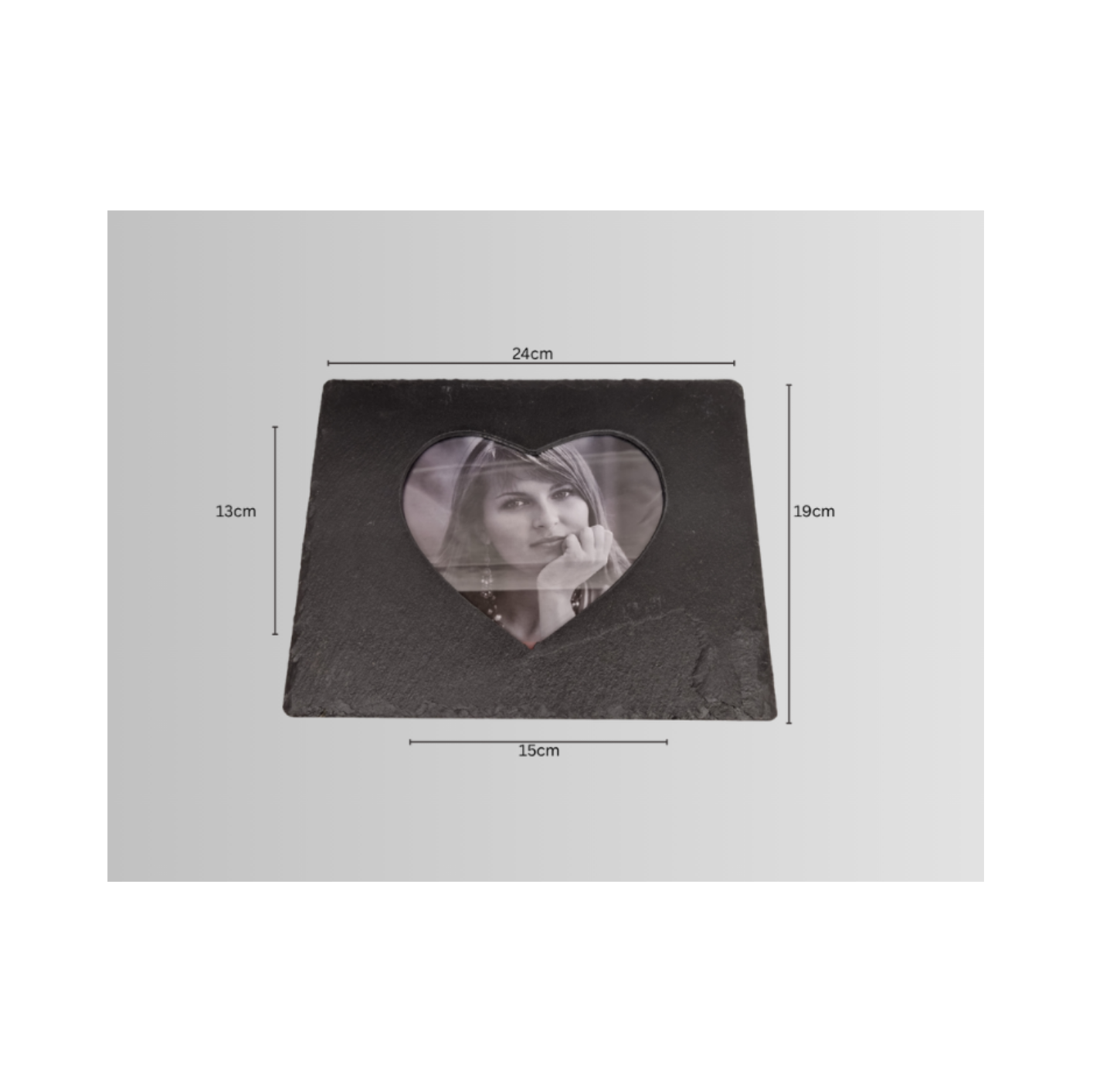 A square black slate photo frame with a heart-shaped cutout in the center, showning  dimension lines indicating 24cm width and 19cm height.