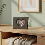 A dark gray slate heart-shaped picture frame with a cutout photo in the center.
