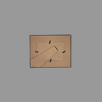 The back of a square picture frame, showing the diagonal support bar.
