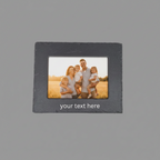A square black picture frame with a sample photo of a family inside and placeholder text 'your text here' at the bottom, shown on a plain background.