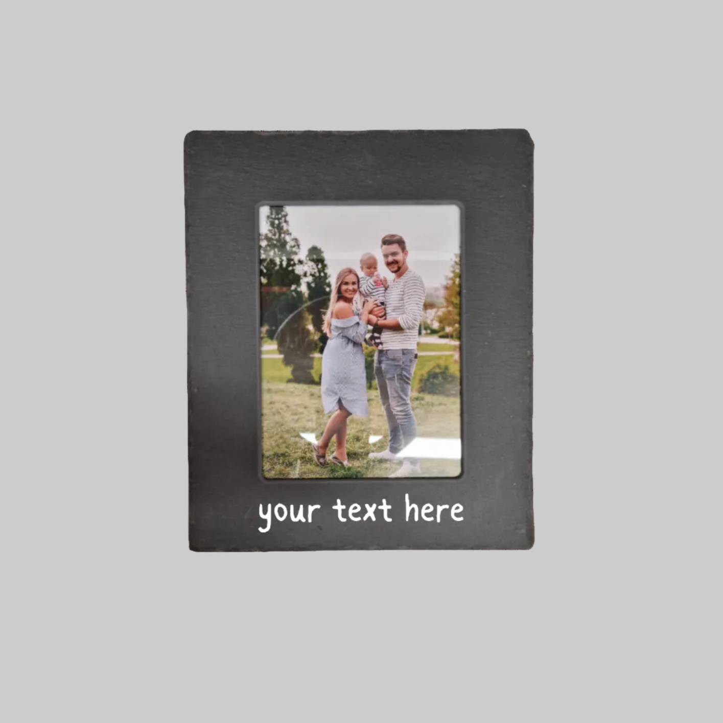 A rectangle black slate photo frame with a custom photo insert of a family and the text 'your text here' printed in at the bottom.