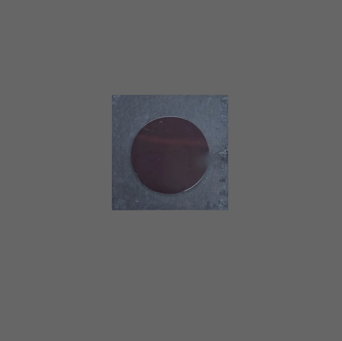 A square slate fridge magnet featuring a large magnet.