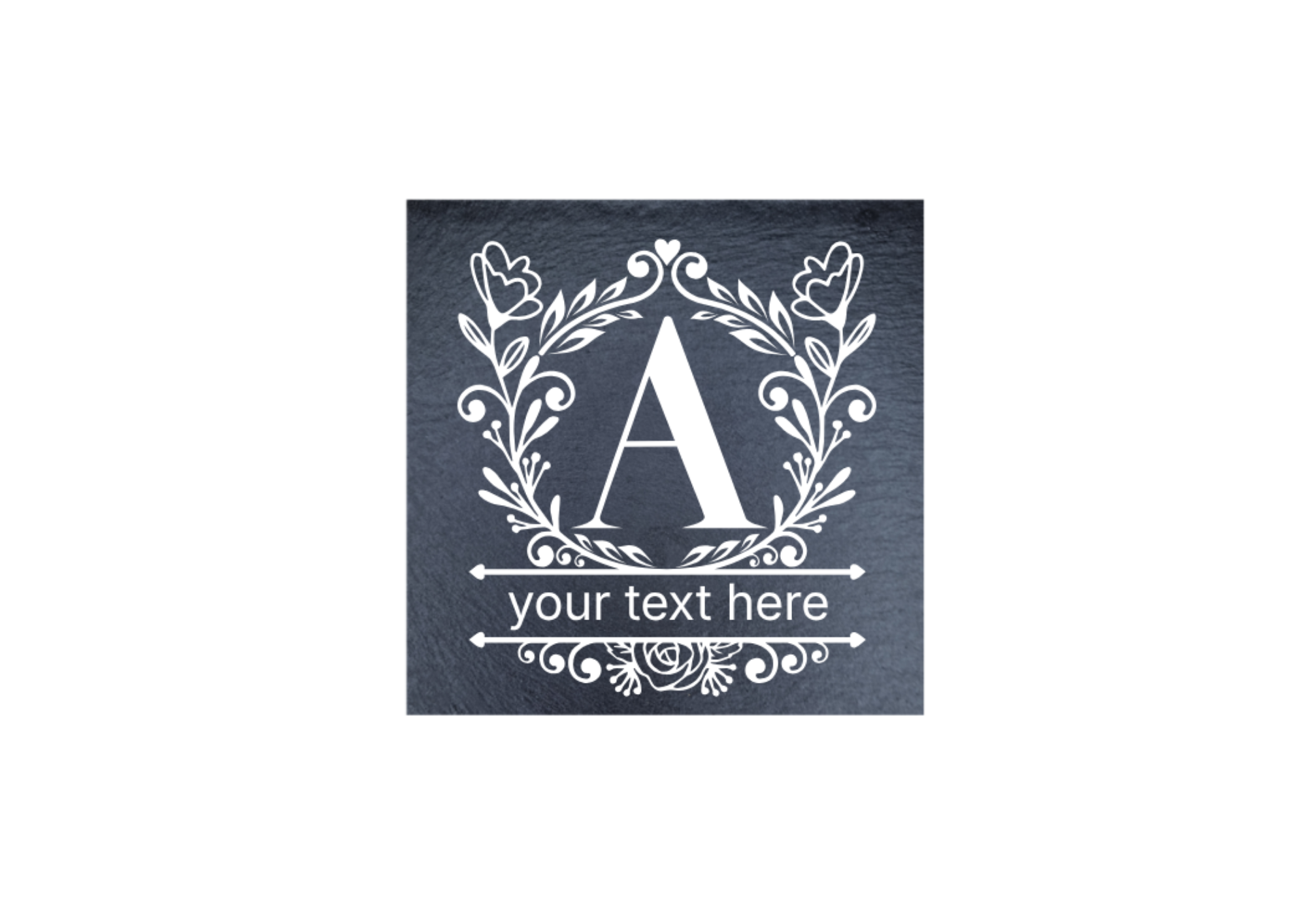 A square dark slate coaster with a decorative floral wreath around a large letter A and the words 'your text here,'.