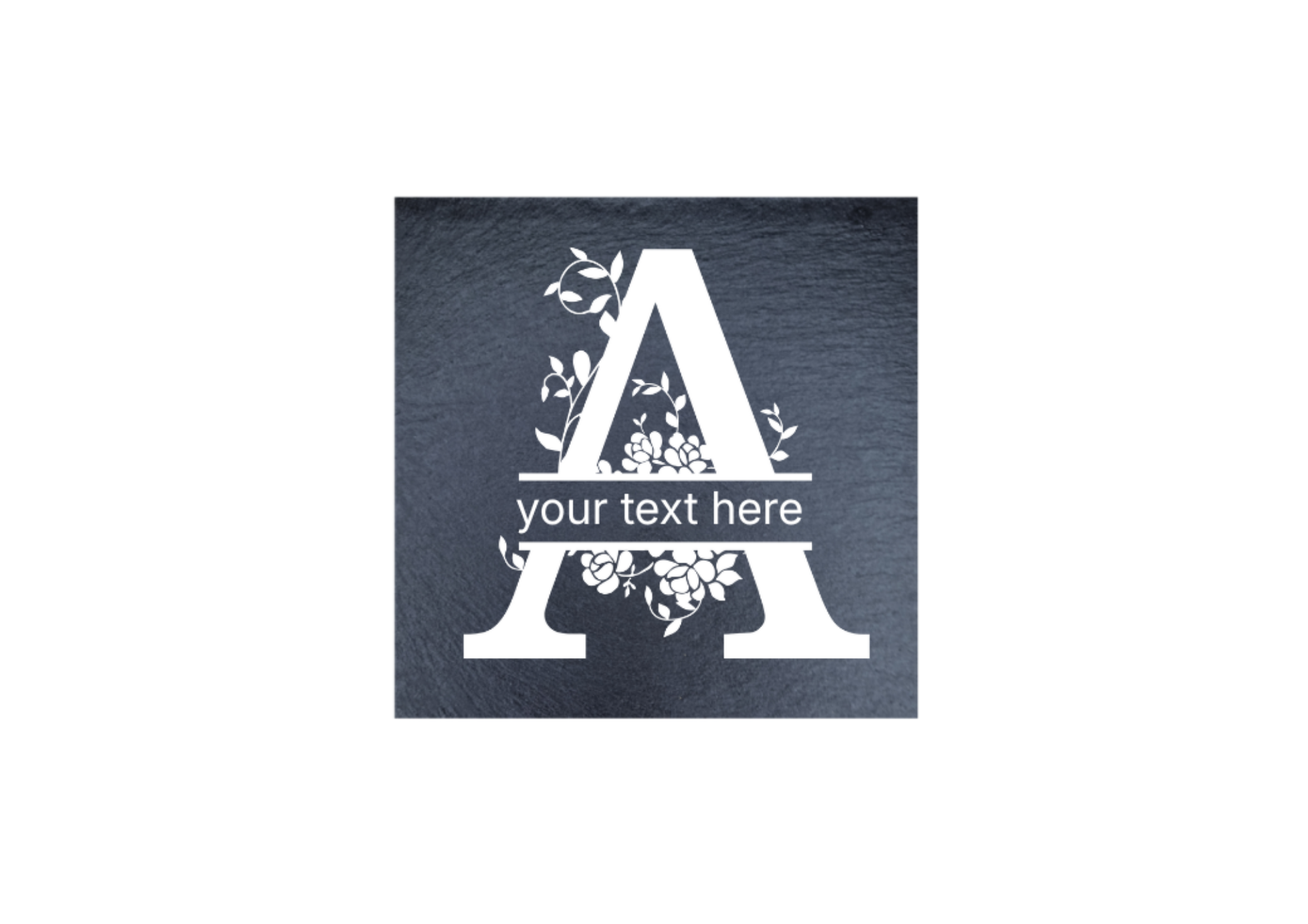 A square dark slate coaster with a decorative floral wreath around a large letter A and the words 'your text here,'.