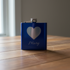 A blue flask with a silver heart emblem and the name 'Mary' printed on the front.